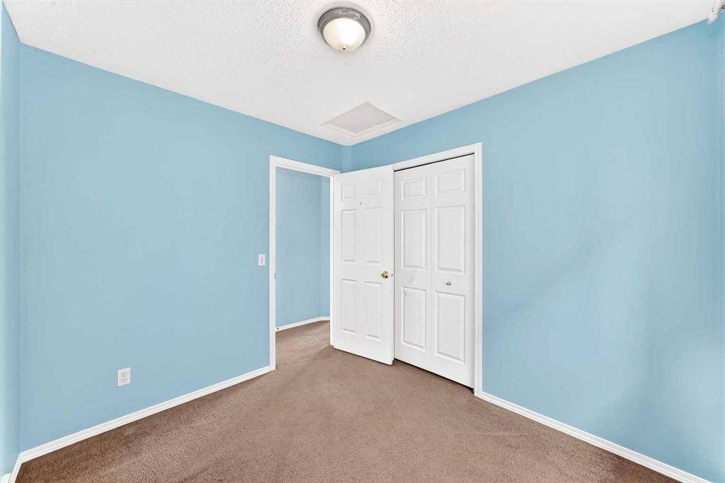 76 Coville Close Ne, Calgary, AB - Indoor Photo Showing Other Room