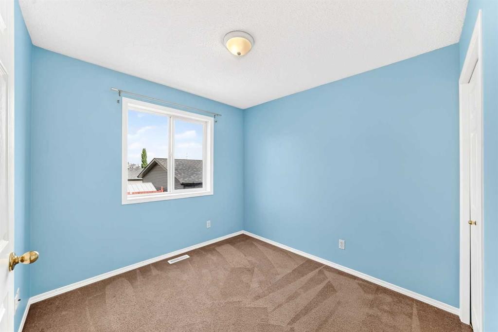 76 Coville Close Ne, Calgary, AB - Indoor Photo Showing Other Room