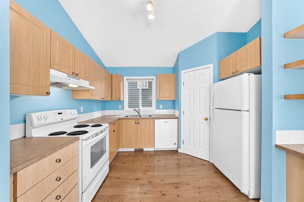 76 Coville Close Ne, Calgary, AB - Indoor Photo Showing Kitchen With Double Sink