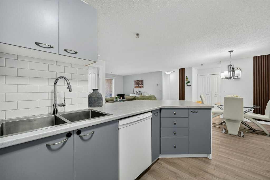 2207-12 Cimarron Common, Okotoks, AB - Indoor Photo Showing Kitchen With Double Sink