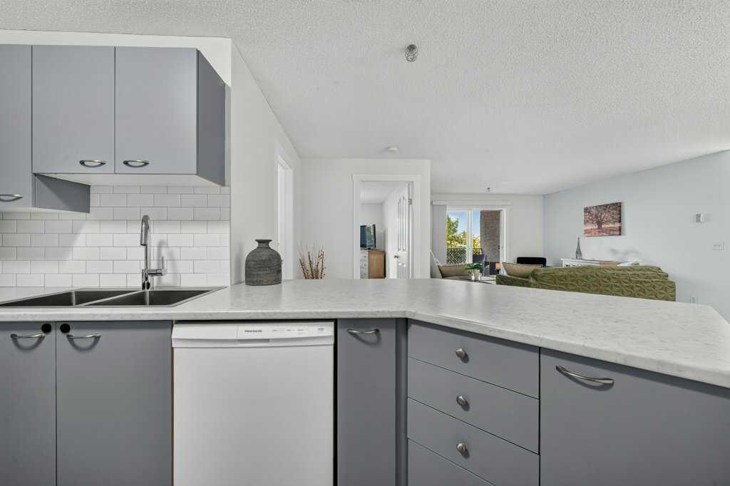 2207-12 Cimarron Common, Okotoks, AB - Indoor Photo Showing Kitchen With Double Sink