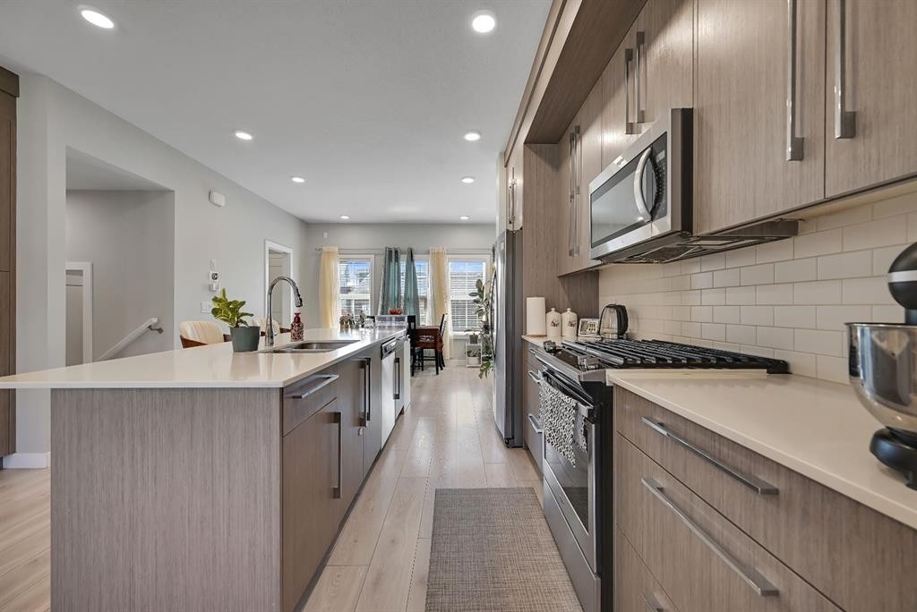 1265 Carrington Boulevard Nw, Calgary, AB - Indoor Photo Showing Kitchen With Upgraded Kitchen