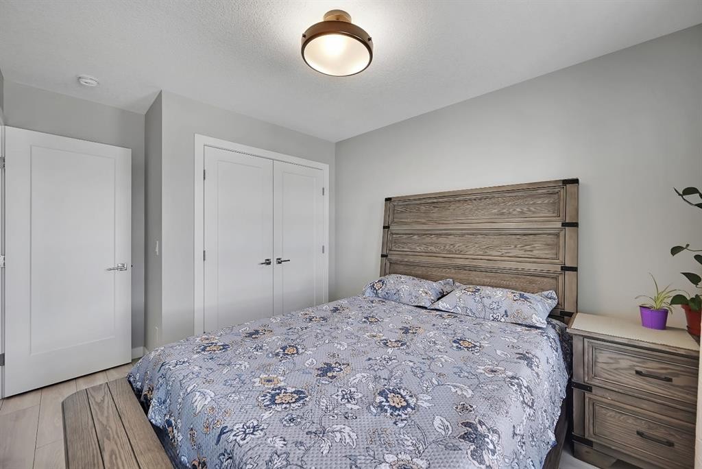 1265 Carrington Boulevard Nw, Calgary, AB - Indoor Photo Showing Bedroom
