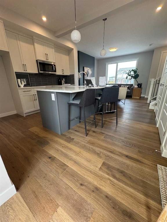 191 Lanark Gate Se, Airdrie, AB - Indoor Photo Showing Kitchen With Upgraded Kitchen