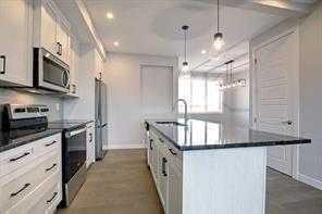 191 Lanark Gate Se, Airdrie, AB - Indoor Photo Showing Kitchen With Upgraded Kitchen