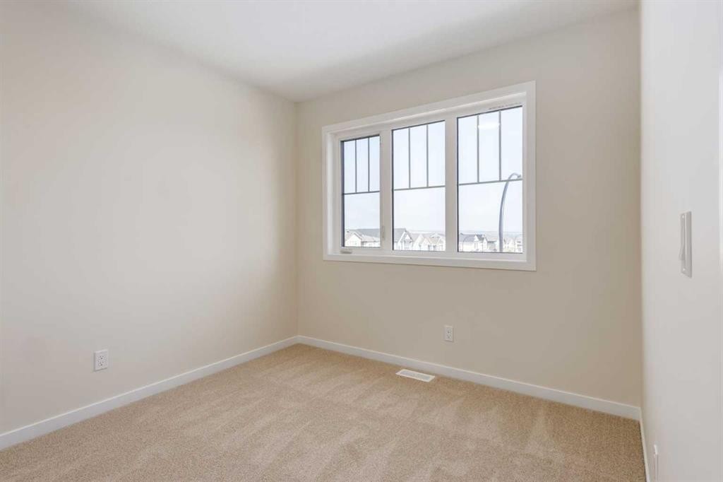 88 Bluerock Terrace Sw, Calgary, AB - Indoor Photo Showing Other Room