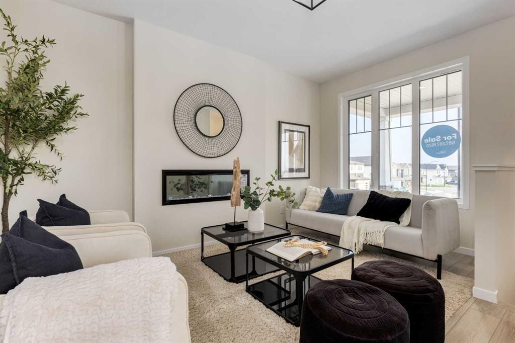 88 Bluerock Terrace Sw, Calgary, AB - Indoor Photo Showing Living Room With Fireplace