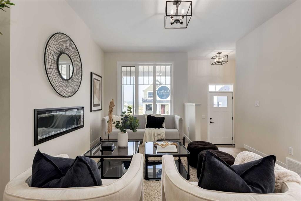 88 Bluerock Terrace Sw, Calgary, AB - Indoor With Fireplace
