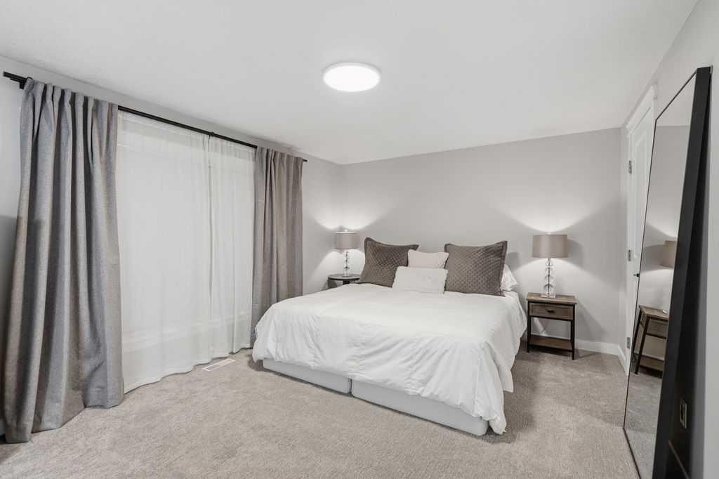 87 Couture Crescent Sw, Calgary, AB - Indoor Photo Showing Bedroom