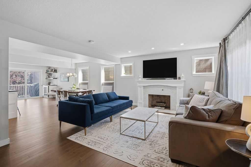 87 Couture Crescent Sw, Calgary, AB - Indoor Photo Showing Living Room With Fireplace