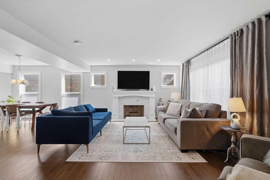 87 Couture Crescent Sw, Calgary, AB - Indoor Photo Showing Living Room With Fireplace
