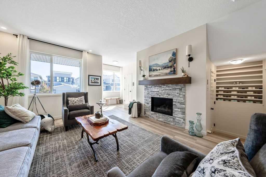 114 Seton Grove Se, Calgary, AB - Indoor Photo Showing Living Room With Fireplace