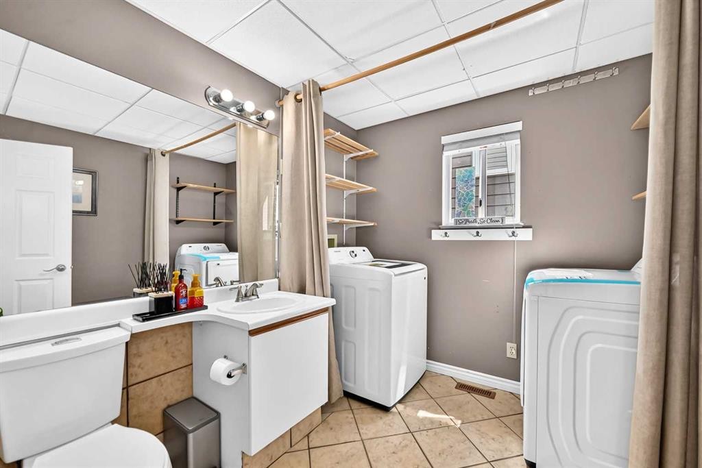 144 Riverstone Crescent Se, Calgary, AB - Indoor Photo Showing Laundry Room