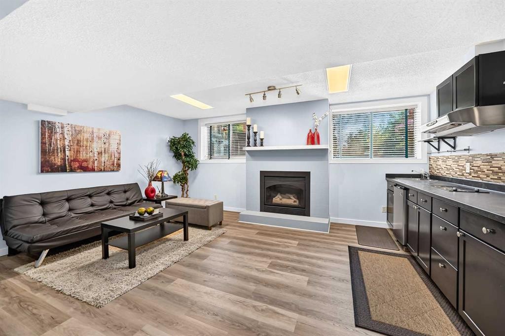 144 Riverstone Crescent Se, Calgary, AB - Indoor Photo Showing Living Room With Fireplace