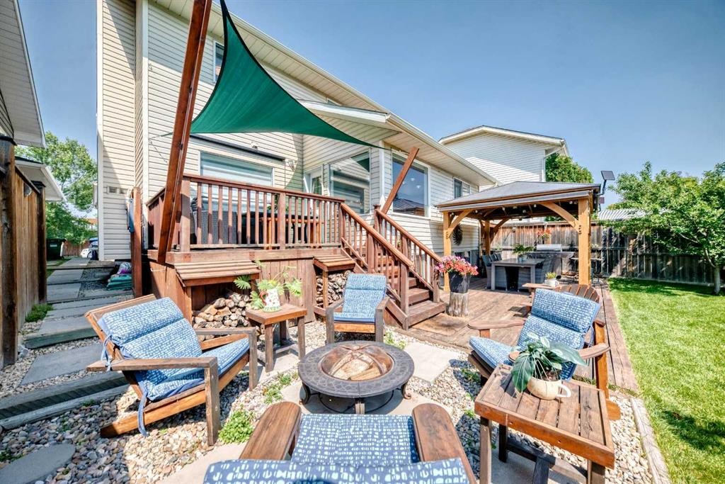 144 Riverstone Crescent Se, Calgary, AB - Outdoor With Deck Patio Veranda With Exterior