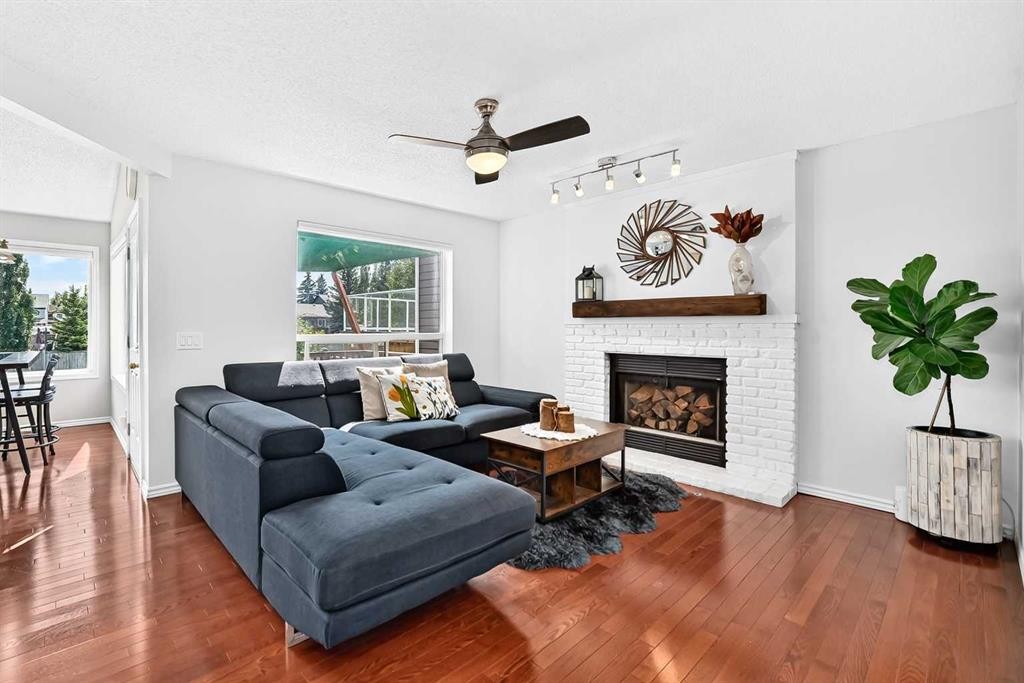 144 Riverstone Crescent Se, Calgary, AB - Indoor Photo Showing Living Room With Fireplace