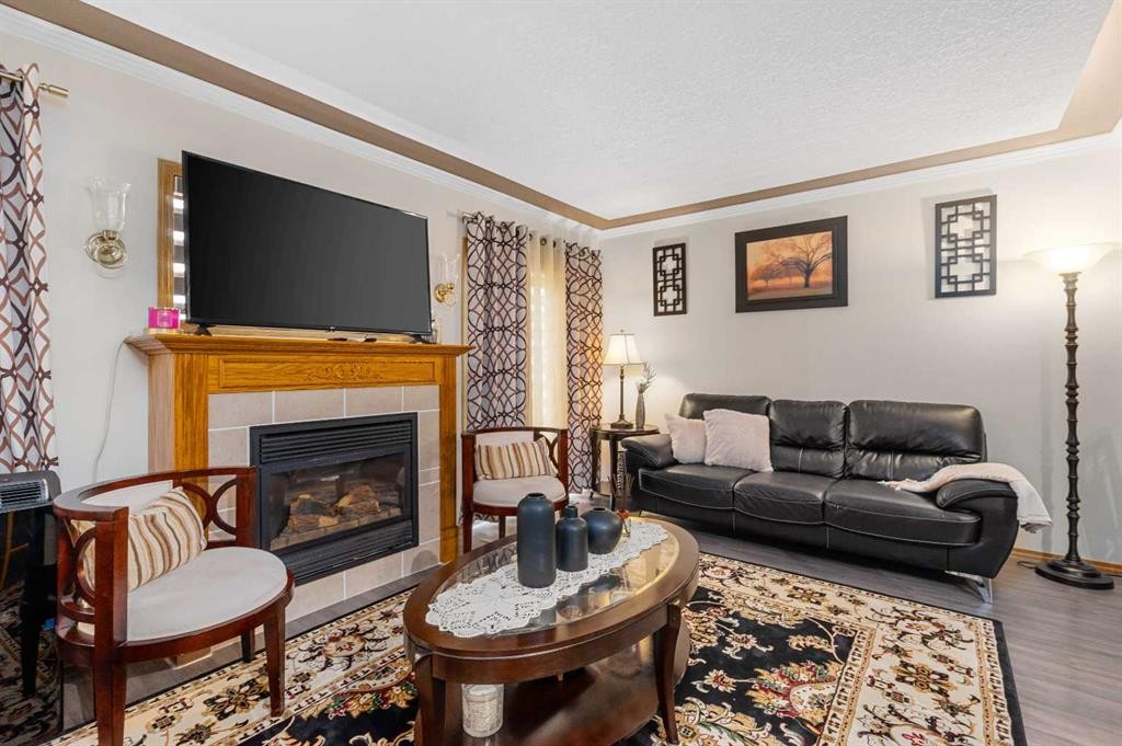 160 Millview Green Sw, Calgary, AB - Indoor Photo Showing Living Room With Fireplace
