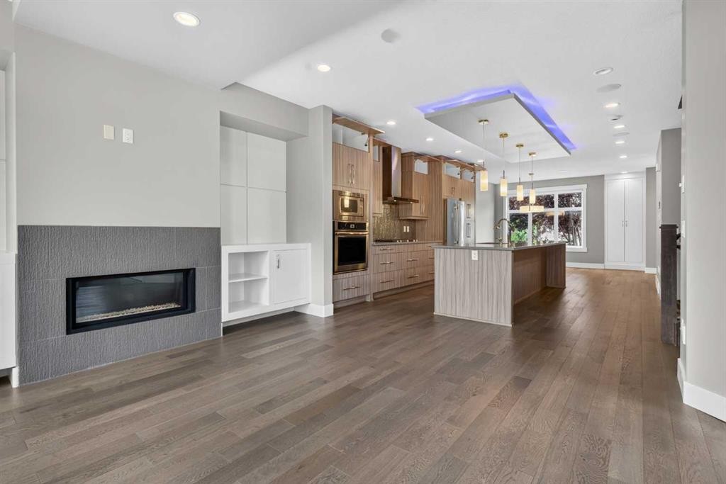 3318 Centre B Street Nw, Calgary, AB - Indoor Photo Showing Living Room With Fireplace