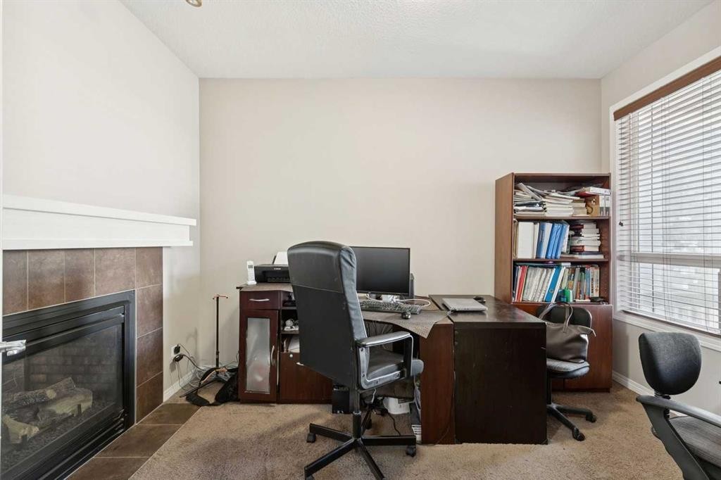 92 Cougar Ridge Close Sw, Calgary, AB - Indoor Photo Showing Office With Fireplace