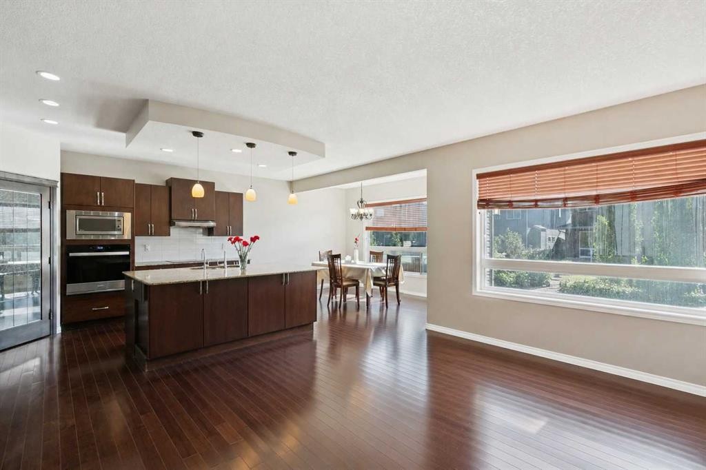 92 Cougar Ridge Close Sw, Calgary, AB - Indoor Photo Showing Living Room With Fireplace