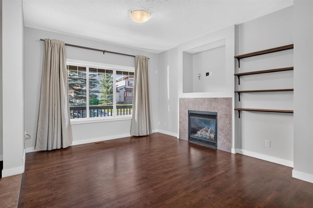 22 Panora Road Nw, Calgary, AB - Indoor Photo Showing Living Room With Fireplace