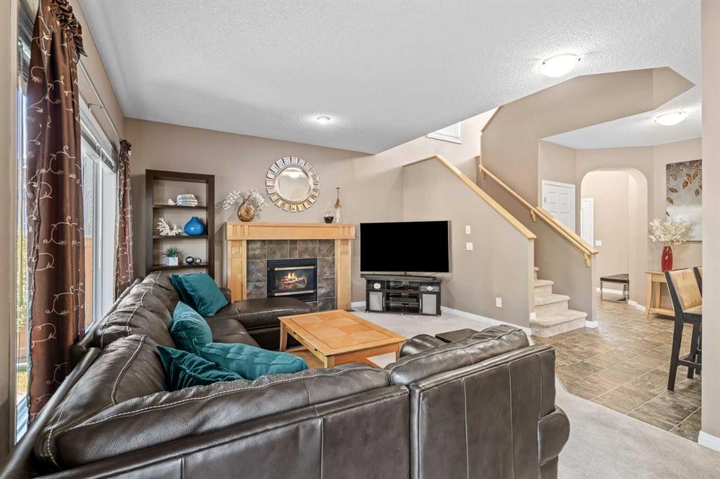 52 Copperfield Close Se, Calgary, AB - Indoor Photo Showing Other Room With Fireplace