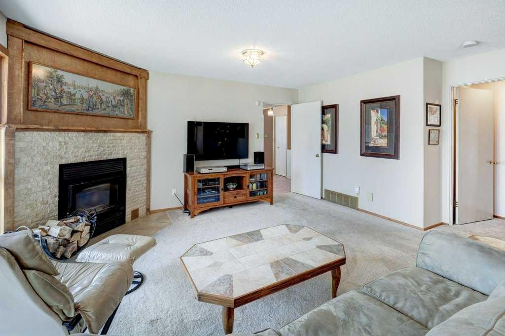 223 Willow Ridge Place Se, Calgary, AB - Indoor Photo Showing Living Room With Fireplace