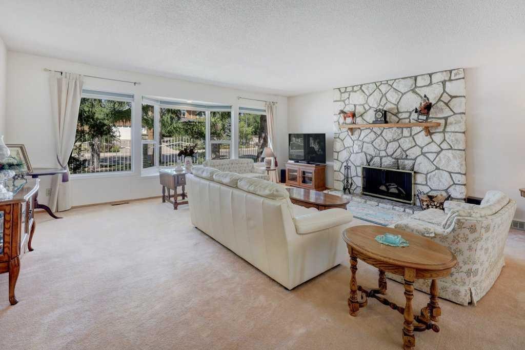 223 Willow Ridge Place Se, Calgary, AB - Indoor Photo Showing Living Room With Fireplace