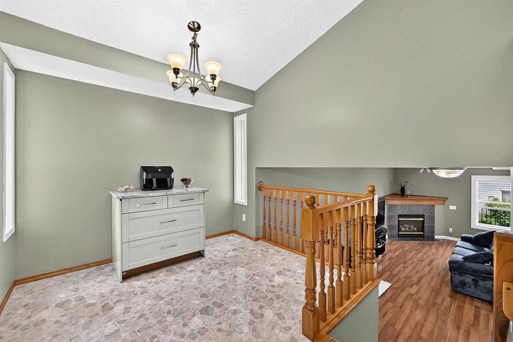 27 Erin Meadow Crescent Se, Calgary, AB - Indoor Photo Showing Other Room With Fireplace