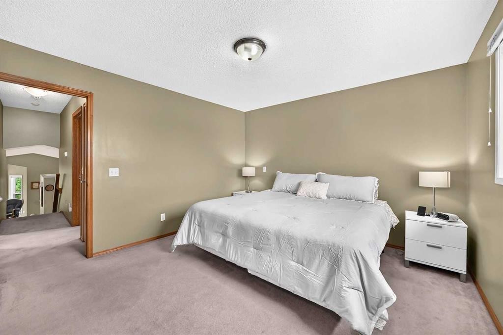 27 Erin Meadow Crescent Se, Calgary, AB - Indoor Photo Showing Bedroom