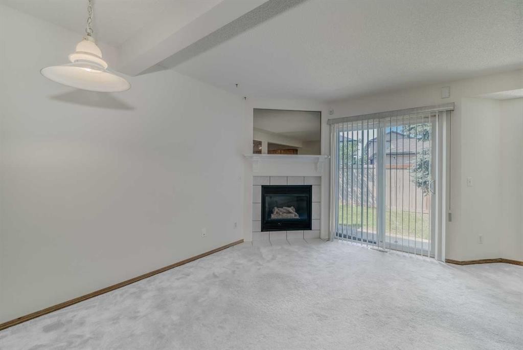 15 Harvest Glen Heights Ne, Calgary, AB - Indoor Photo Showing Living Room With Fireplace