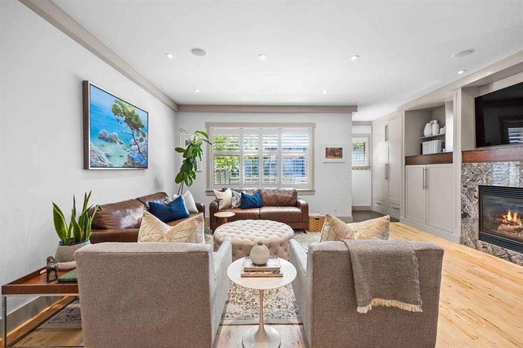 211 32 Avenue Nw, Calgary, AB - Indoor Photo Showing Living Room With Fireplace