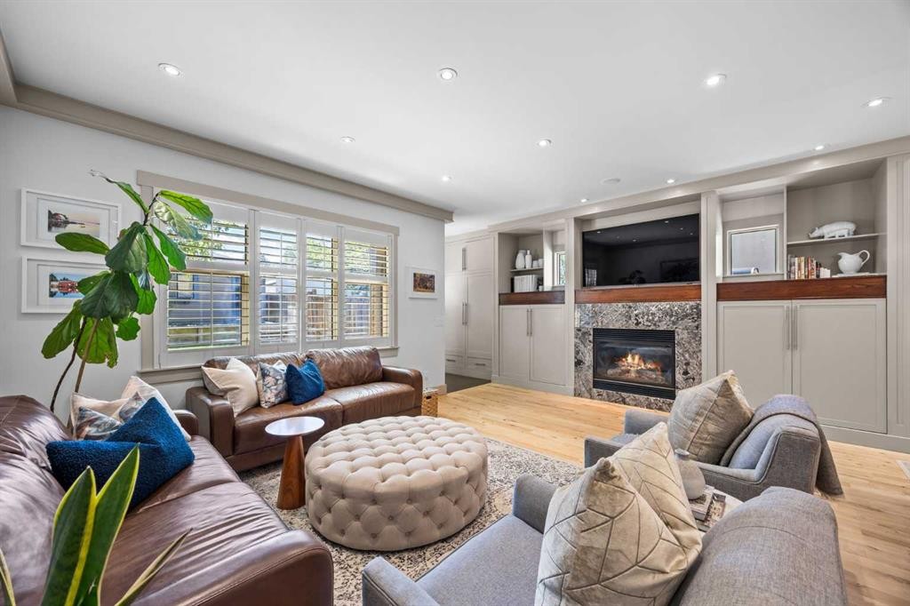 211 32 Avenue Nw, Calgary, AB - Indoor Photo Showing Living Room With Fireplace