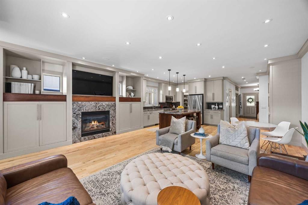 211 32 Avenue Nw, Calgary, AB - Indoor Photo Showing Living Room With Fireplace