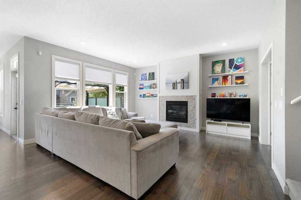 94 Masters Mews Se, Calgary, AB - Indoor Photo Showing Living Room With Fireplace