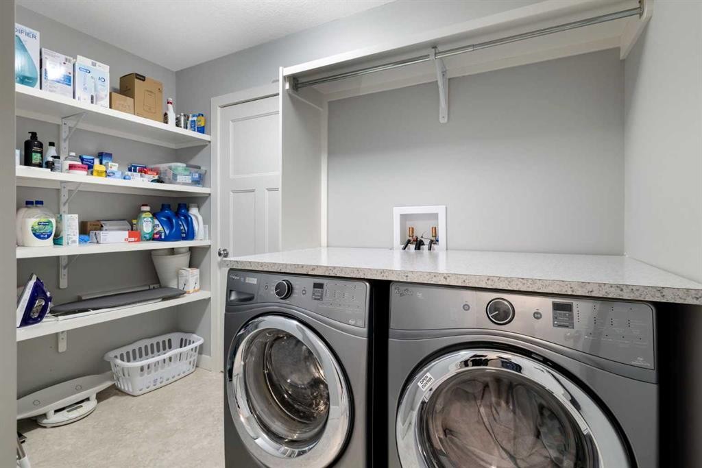 94 Masters Mews Se, Calgary, AB - Indoor Photo Showing Laundry Room
