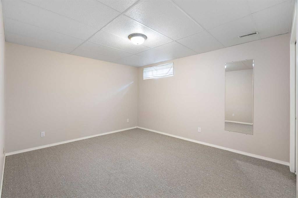 77 Tararidge Circle Ne, Calgary, AB - Indoor Photo Showing Other Room