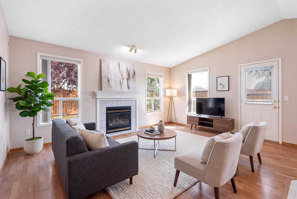 77 Tararidge Circle Ne, Calgary, AB - Indoor Photo Showing Living Room With Fireplace