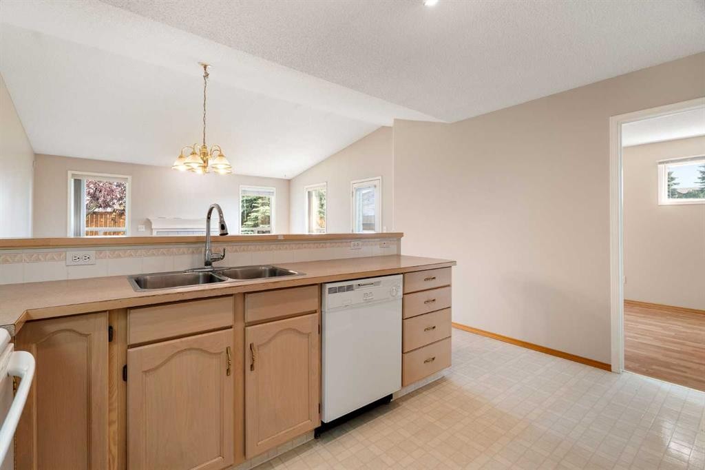 77 Tararidge Circle Ne, Calgary, AB - Indoor Photo Showing Kitchen With Double Sink