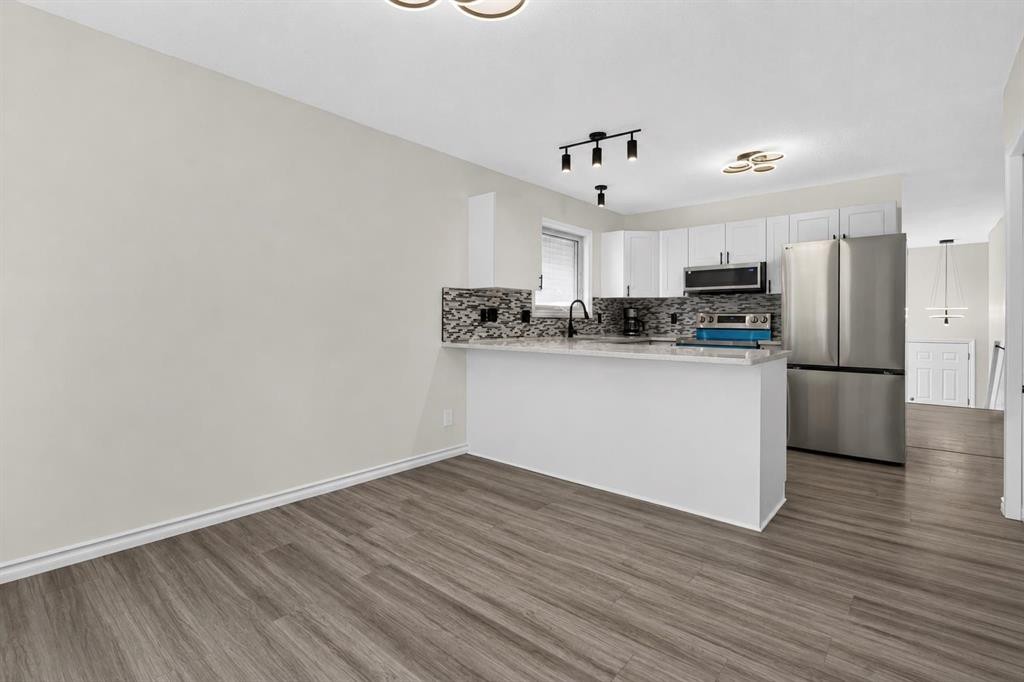250 Bridlewood Circle Sw, Calgary, AB - Indoor Photo Showing Kitchen With Stainless Steel Kitchen