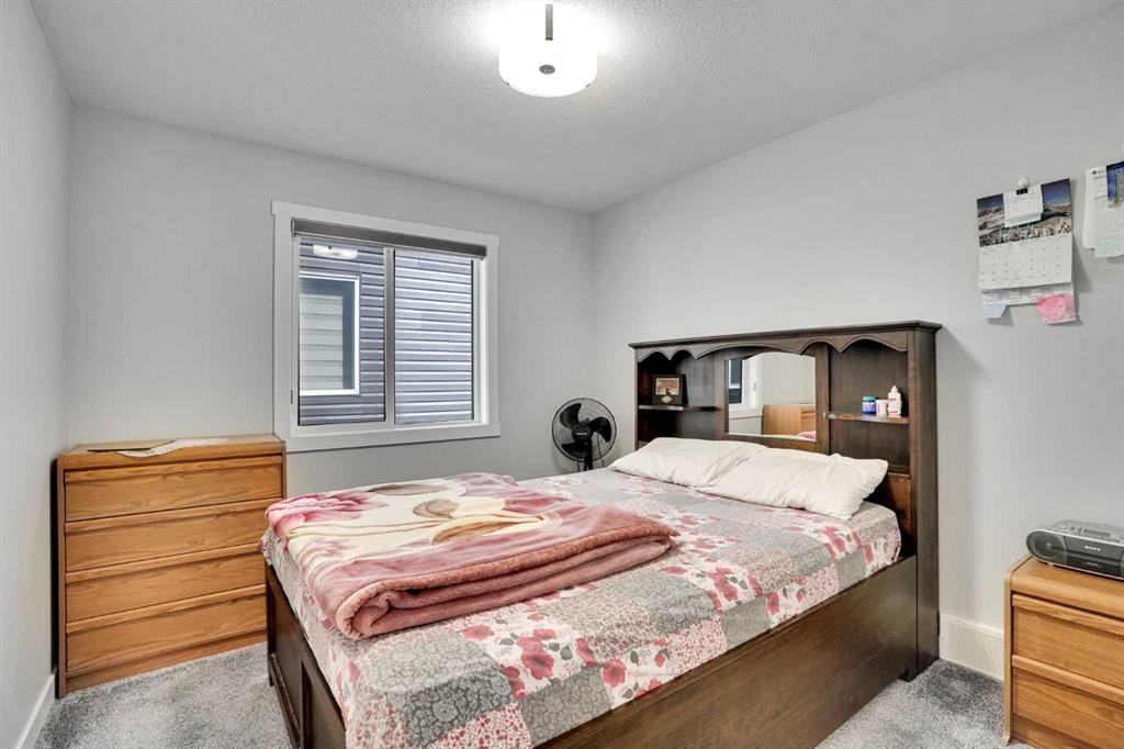 50 Saddlestone Place Ne, Calgary, AB - Indoor Photo Showing Bedroom