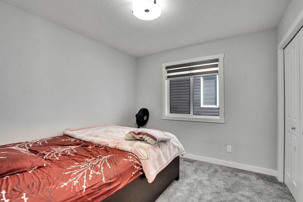 50 Saddlestone Place Ne, Calgary, AB - Indoor Photo Showing Bedroom
