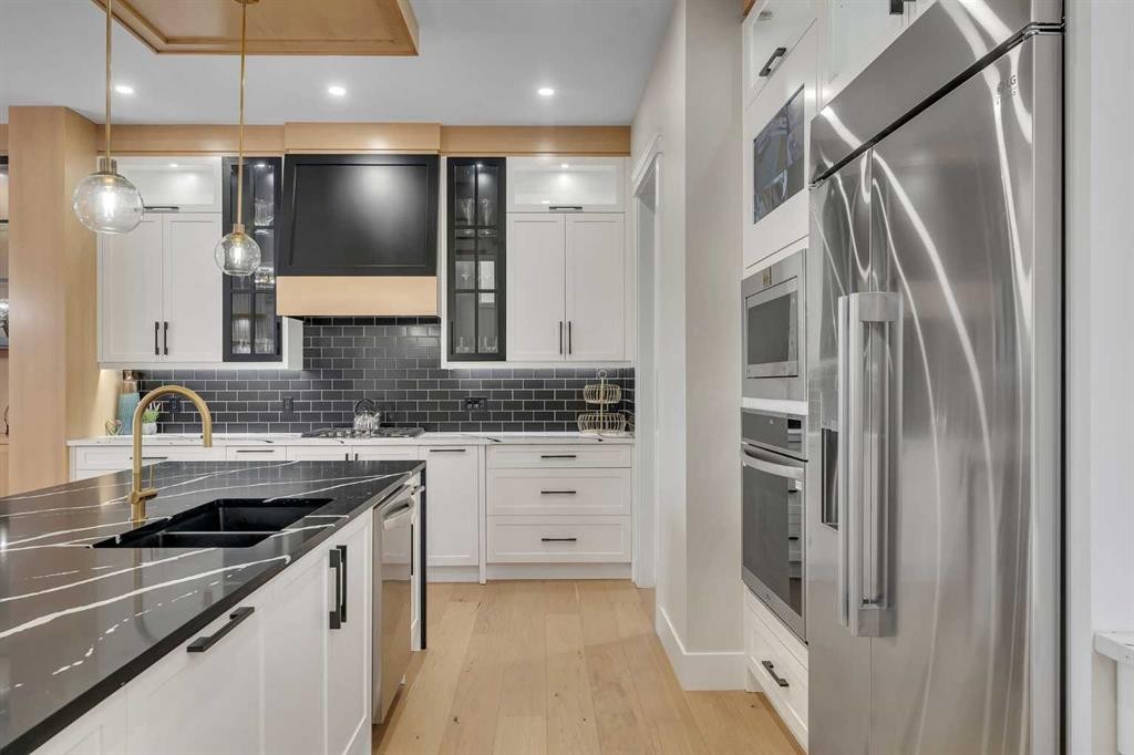 2012 Waterbury Road, Chestermere, AB - Indoor Photo Showing Kitchen With Double Sink With Upgraded Kitchen