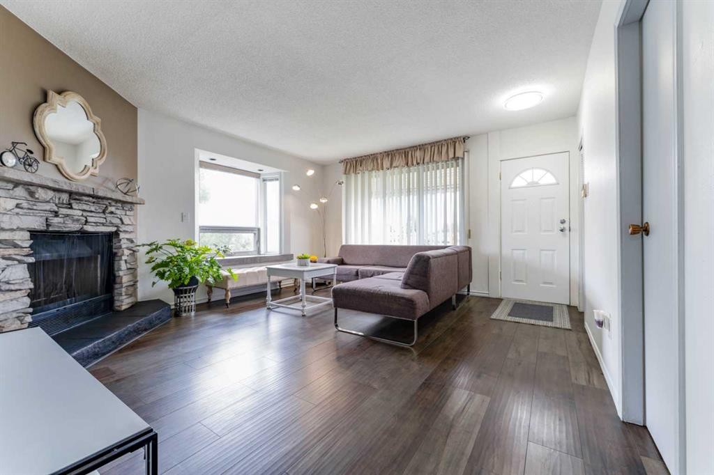 1502 40 Street Se, Calgary, AB - Indoor Photo Showing Living Room With Fireplace