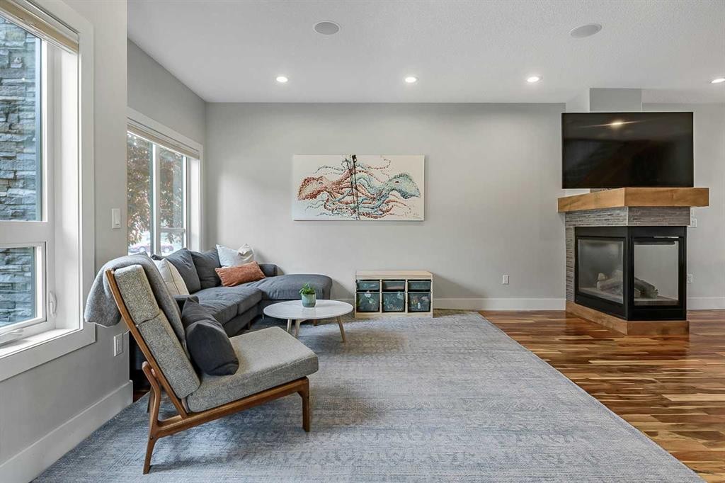 5013 23 Avenue Nw, Calgary, AB - Indoor Photo Showing Living Room With Fireplace