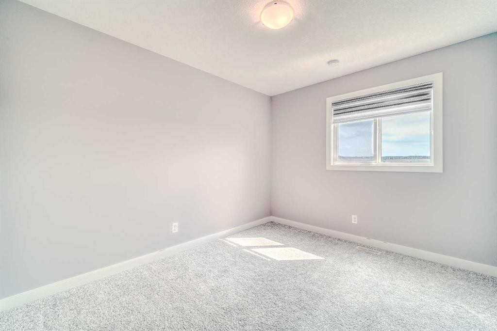 22 Sage Bluff Heights Nw, Calgary, AB - Indoor Photo Showing Other Room