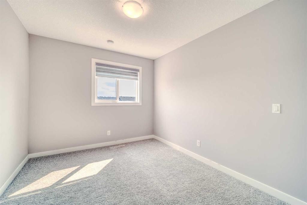 22 Sage Bluff Heights Nw, Calgary, AB - Indoor Photo Showing Other Room