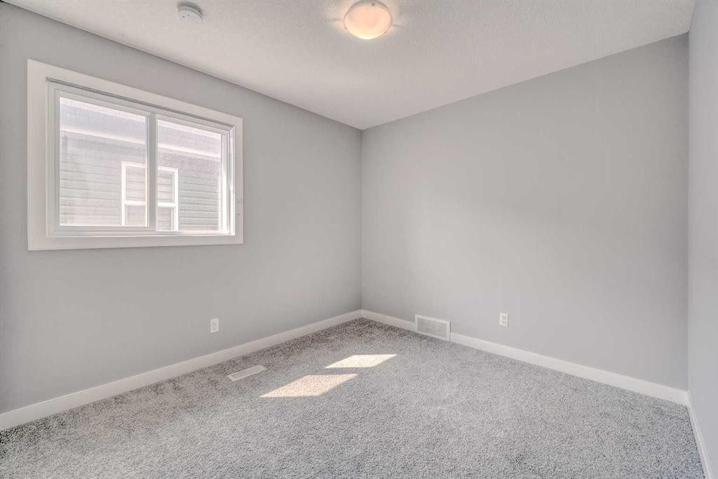 22 Sage Bluff Heights Nw, Calgary, AB - Indoor Photo Showing Other Room
