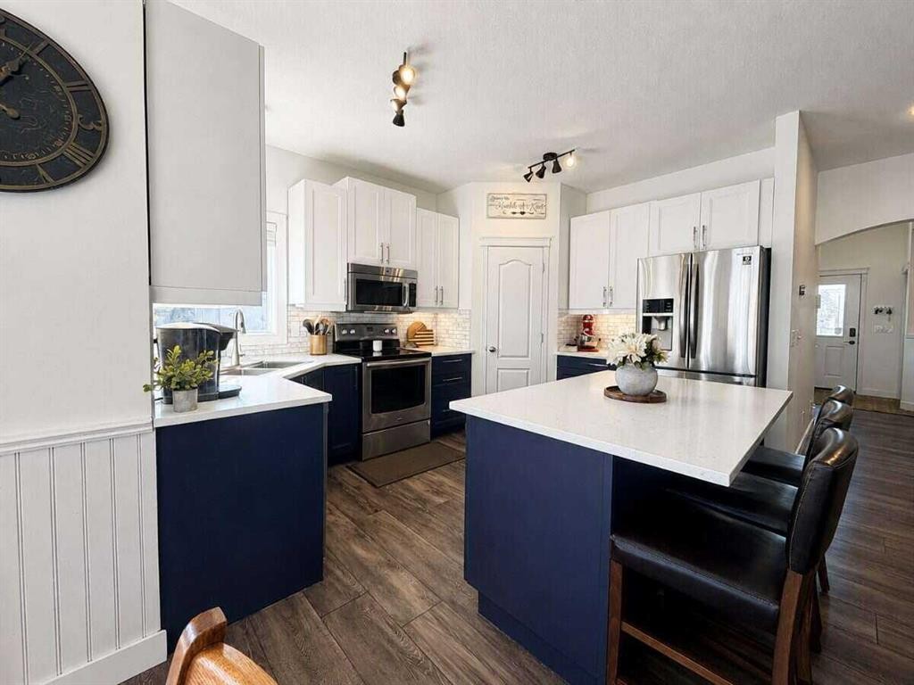 24 Brander Avenue Nw, Langdon, AB - Indoor Photo Showing Kitchen With Stainless Steel Kitchen