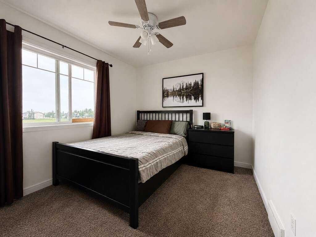 24 Brander Avenue Nw, Langdon, AB - Indoor Photo Showing Bedroom